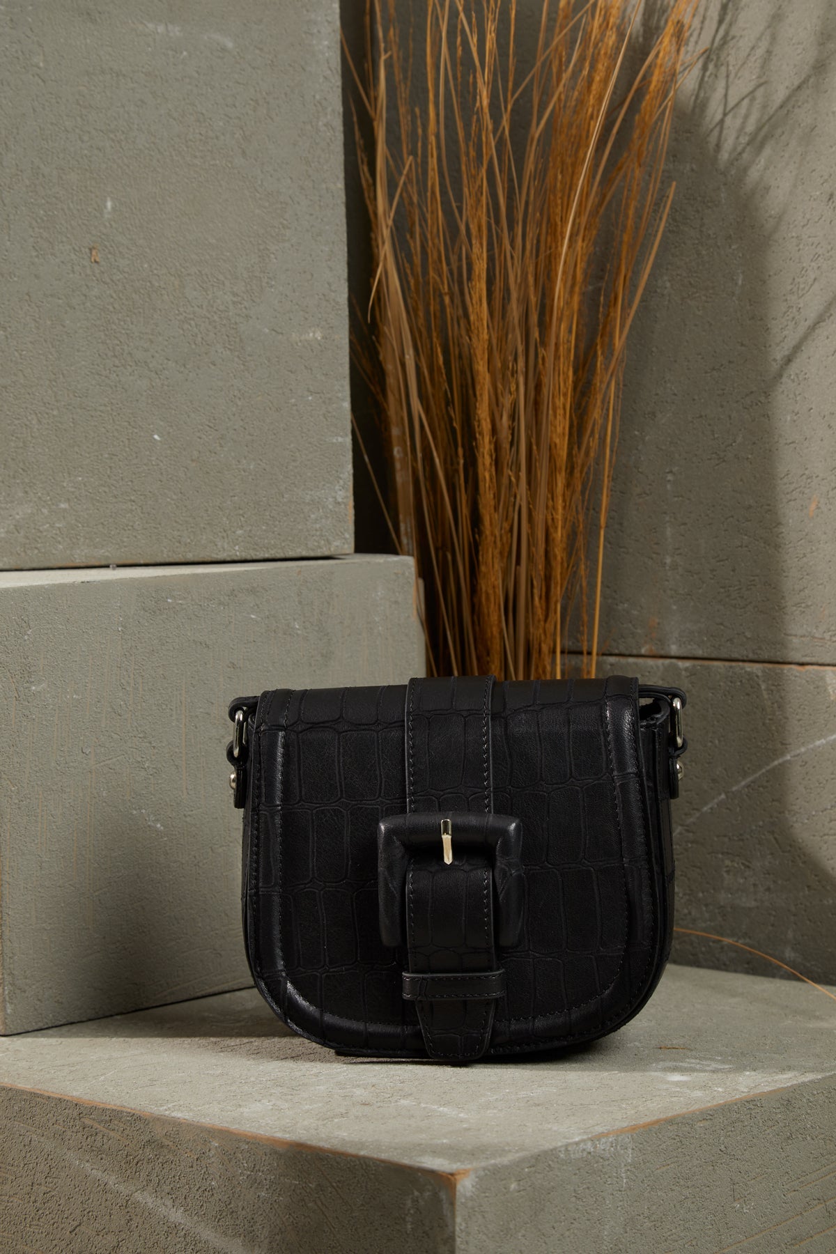 Adjustable Strapped Leather Bag with Front Belt Buckle Pattern