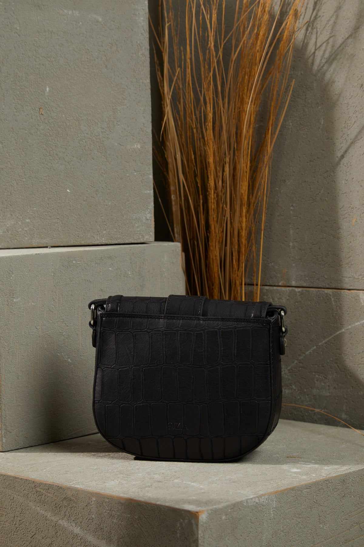 Adjustable Strapped Leather Bag with Front Belt Buckle Pattern